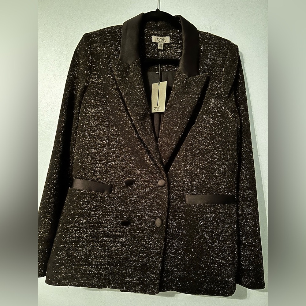 Women’s holiday blazer in size large.  New with tag